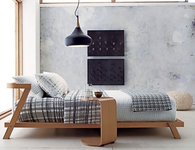 A plywood mid century modern bed with a matching mini side table is a stylish solution for a cozy bedroom