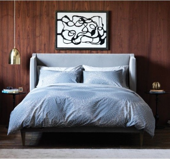 a light grey upholstered bed with a curved headboard will make your bedroom welcoming and cozy
