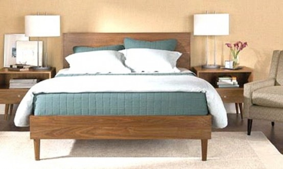 a warm-stained wooden bed and nightstands will be a nice base for a mid-century modern space