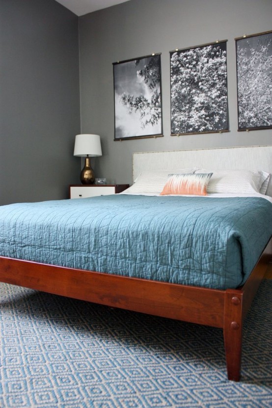 a redwood bed with a white upholstered headboard and white and rich stained wooden nightstands for a chic mid-century modern bedroom