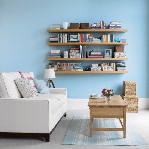 IKEA Lack are probably the cheapest floating shelves you could hang in your living room. They come in different sizes and are perfect to display your books and other treasures.