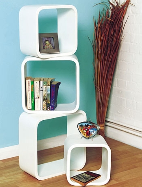 Stylish free-standing shelves might not be as effective for storage as large bookcases but they can make your living room looks less boring and more cool.