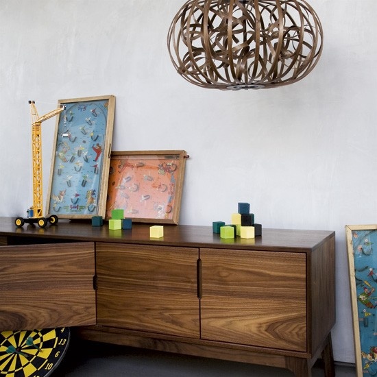 Hide away your living room stuff in a stylish sideboard. It's top could also be used to display some art.