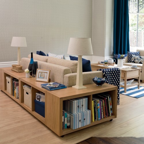 Cabinets around the sofa is a smart way to use the space if you have an open-plan living room.