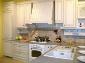 a whitewashed vintage kitchen with a matching hood is a pretty idea for those who love everything delicate and lightweight-looking