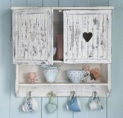 a vintage planked whitewashed cabinet with a closed and an open shelf is a lovely idea for a shabby chic kitchen and won’t take much space