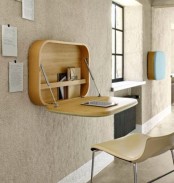 a plywood bureau or desk like this one will let you work, sign papers and do other simple stuff and then fold it back