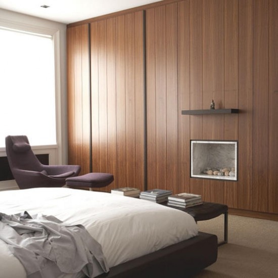 You can design a wardrobe to occupy the whole wall to make your room minimalist but with lots of storage space.