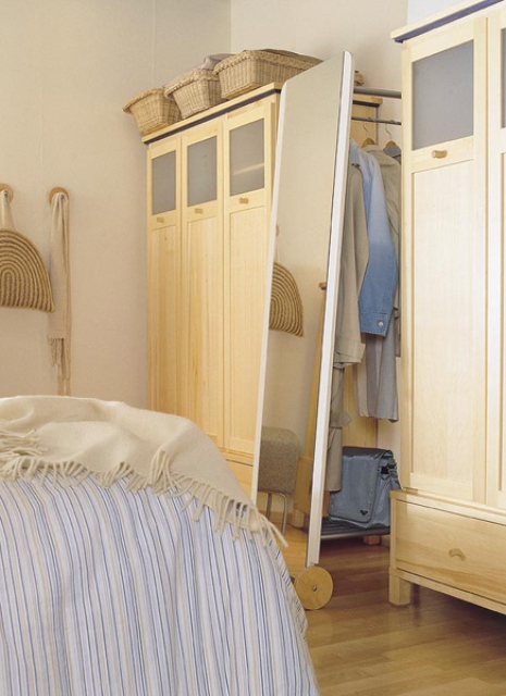A full-size mirror could hide a coat rack that is easy to access.