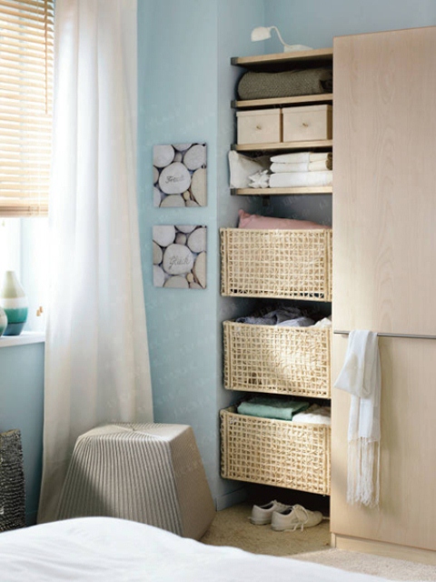 If you have s free space that is to small for a wardrobe then install floating shelves there. They are perfect to display things on them but you can use them for storage baskets too.