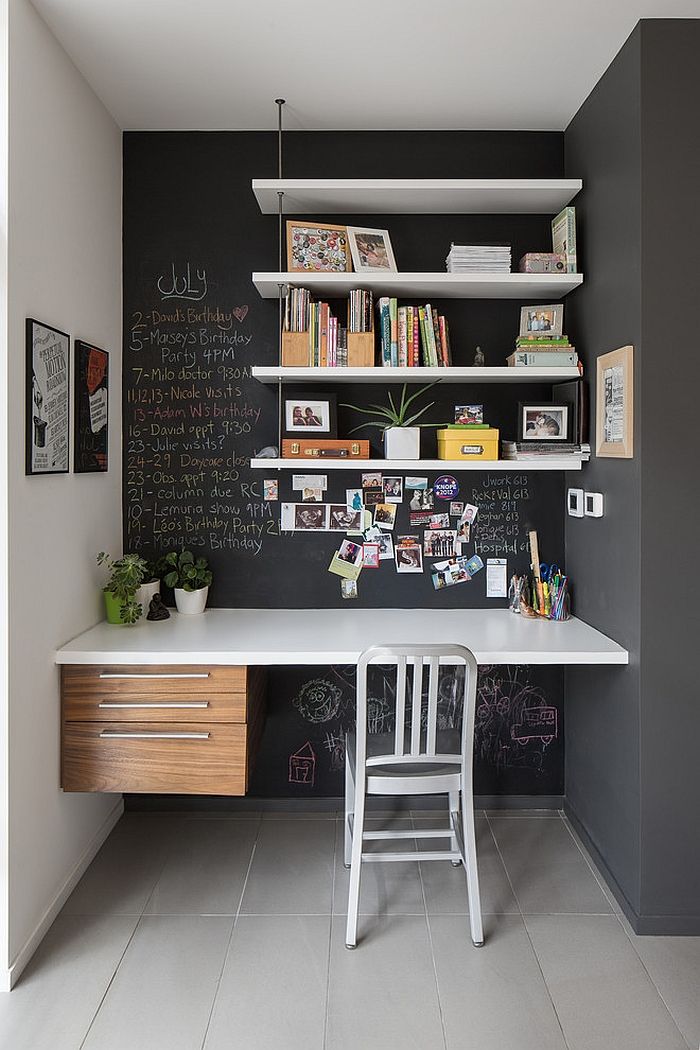 A small chalkboard nook with walls, on which you can chalk, with wall mounted shelves, a built in desk, a white chair is a lovely space