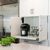 a hidden coffee bar in the cabinet, with a coffee machine and some necessary stuff – close the doors and it will be hidden