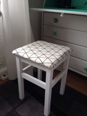 a white IKEA Oddvar stool upholstered with neutral printed fabric is a cool and fresh idea to use in any space