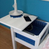 an IKEA Oddvar stool turned into a small nightstand with a box for storage under the top