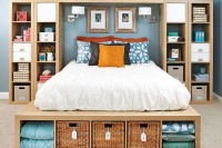 a sleek wooden bed with storage compartments at the foot – finish soem of them with woven boxes for a slight rustic feel