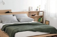 a minimalist light-stained bed with side drawers and an open storage compartment at the foot of the bed plus storage nightstands is a cool solution for a small bedroom