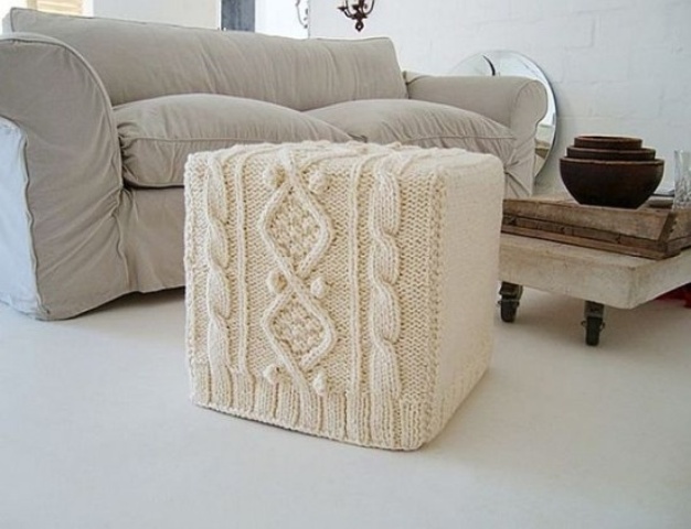 A white knit ottoman will give a touch of coziness to the space and make it more welcoming and winter ready