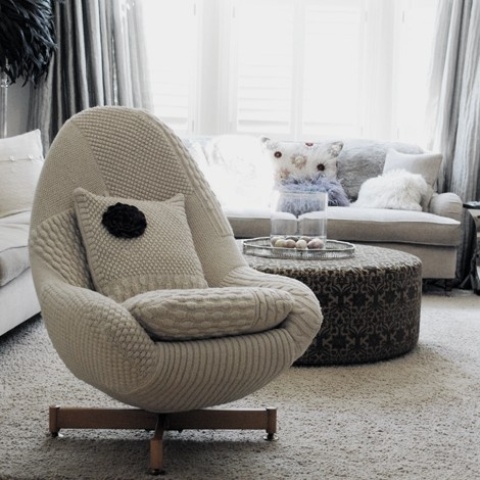 An egg shaped chair with a knit cover is a very nice piece to make your space ready for cold months