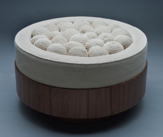 A round seat filled with crocheted balls is a whimsy and non typical piece of furniture to rock