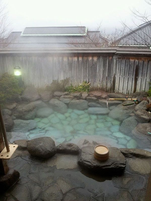 An outdoor hot tub designed with natural stones and rocks   even if there's no hot spring, you can make such a tub yourself