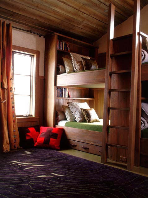 Cozy shared kids room with natural wood all around.