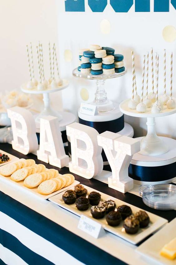 striped navy dessert table for a boy baby shower