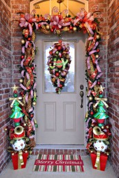 a super colorful garland to contour the door – bright ribbons, ornaments, letters, musical instruments and colorful trees