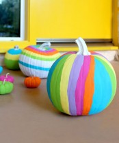 bold and colorful striped neon pumpkins are amazing for decorating a space for Halloween and look gorgeous