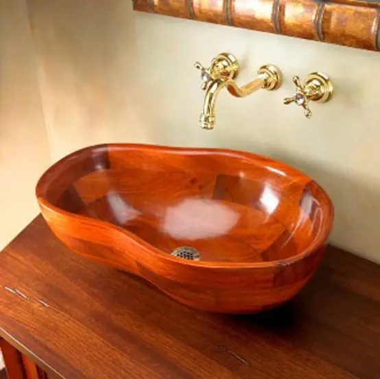 A rich stained wooden vanity paired up with a wooven sink of a whimsical shape is a cool idea for a modern bathroom
