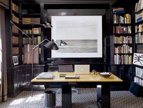 an elegant modern home office paired with a library and black bookcases plus a sleek contemporary desk