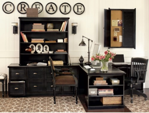 A contrasting vintage inspired home office with black furniture, a shutter pinboard, a large desk and an artwork