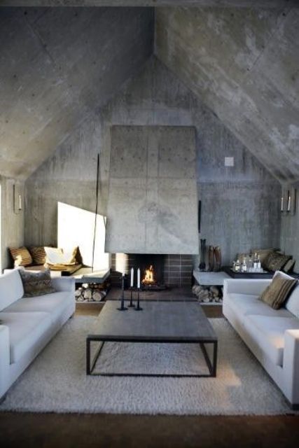 concrete walls, floor and ceiling plus a fireplace hood and firewood storage