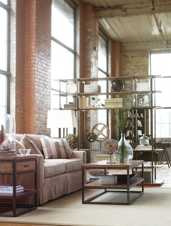 brick walls and vintage industrial furniture in front of them, side tables made of wood and metal