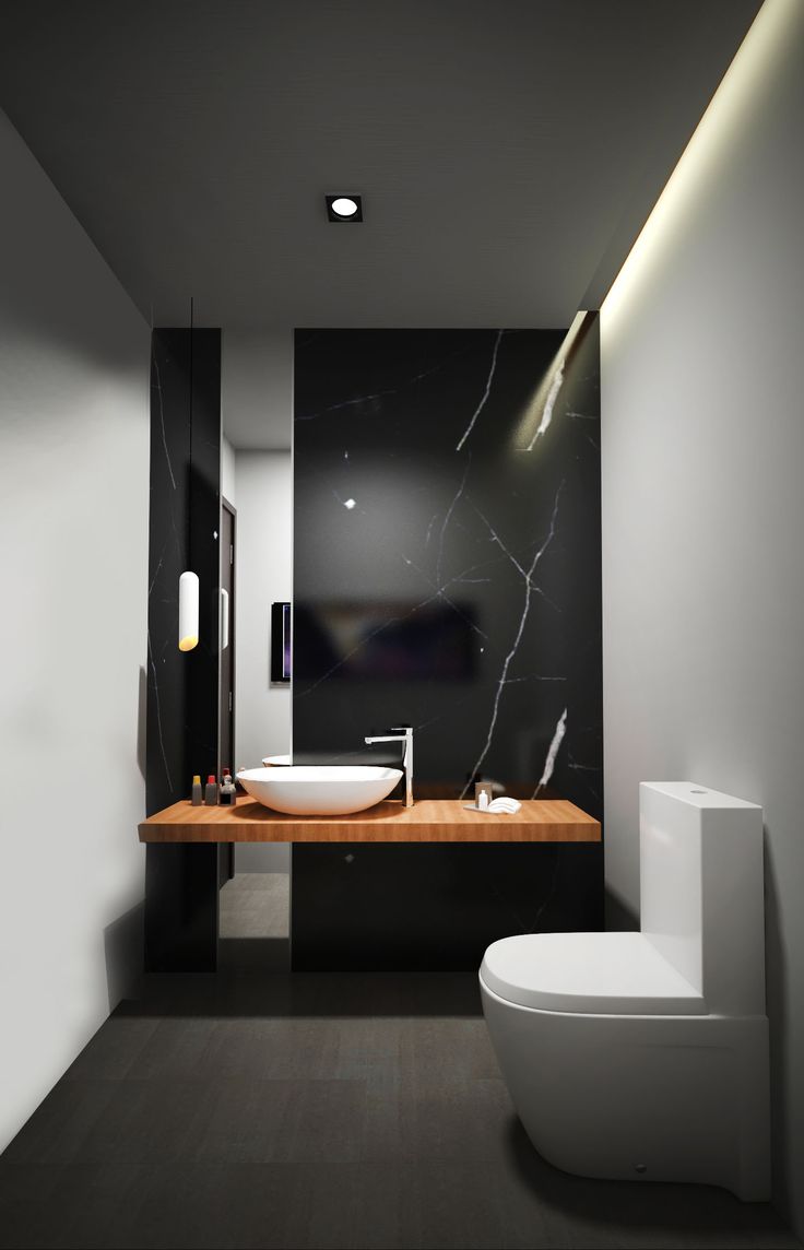 A refined minimalist powder room with a black marble wall, a floating vanity, white walls, white appliances and built in lights