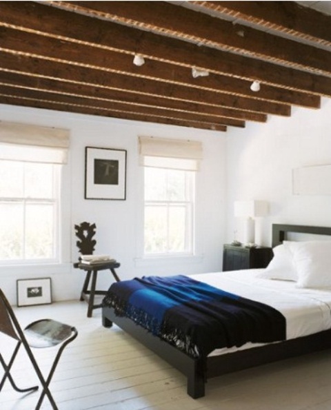 Living exposed beams in a bedroom would work as a charm in a guy's room.