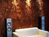 a wood covered wall is a bold statement and a chic idea for decor and soundproofing