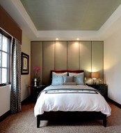 a soundproofing headboard wall done with large neutral-color panels that also form a statement wall