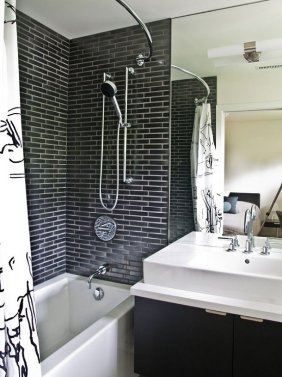 a modern bathroom with a faux grey brick wall, a mirror, a floating vanity and a white sink plus a curtain