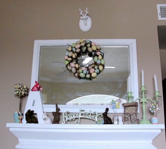 a pastel egg wreath and topiaries, bunny figurines and some monograms