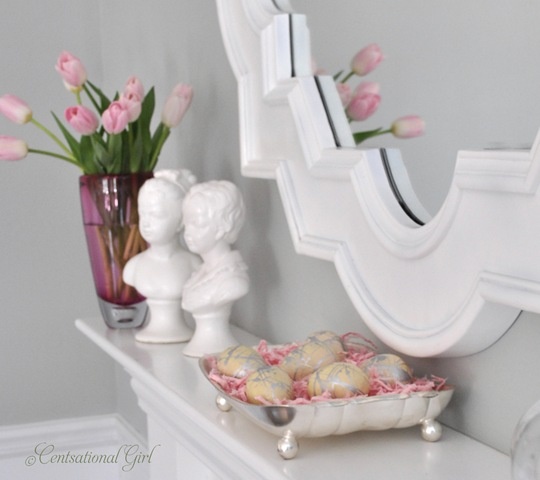 elegant Easter mantel styling with pink tulips and a silver tray with metallic eggs