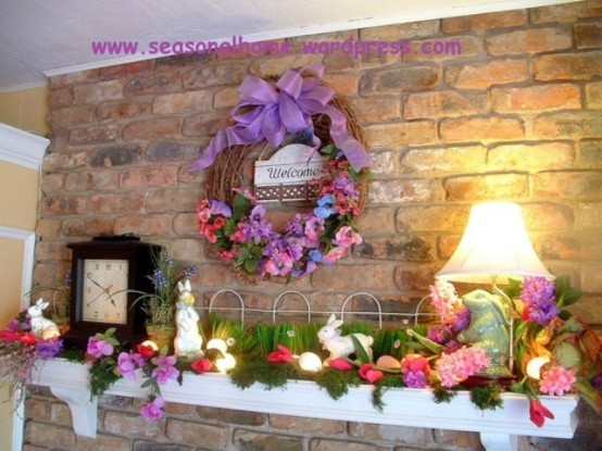 a super colorful Easter mantel with grass, foliage and blooms and with bunny figurines