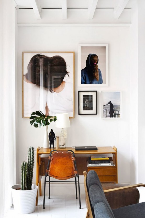 Stylish Eclectic Loft With Clusters Of Art And Framed Photographs