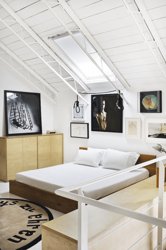 Stylish Eclectic Loft With Clusters Of Art And Framed Photographs