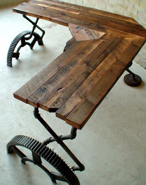 a corner industrial desk of wood and vintage pieces of wheels and pipes is a stylish and cool idea for an industrial home office