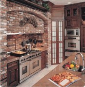 a red brick cooker backsplash and wall plus rich-stained wooden furniture for an elegant rustic kitchen
