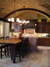 an arched brick ceiling and a matching kitchen island make the space catchier, bolder and bring texture inside