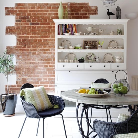 A piece of red brick in the dining zone for more eye catchiness and a bolder look of the space