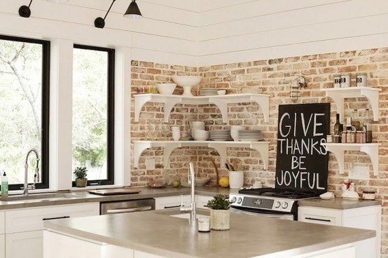 distressed and whitewashed brick walls and white kitchen furniture create a relaxed and distressed rustic feel