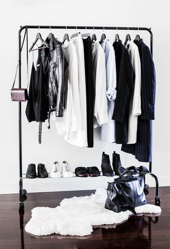 a black makeshift closet with a shoe shelf and a faux fur rug for a Nordic or modern space