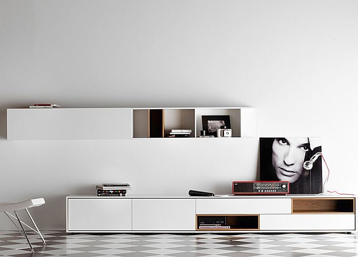 A modern and laconic white wall mounted storage unit and a matching TV unit under it will give you enough storage space